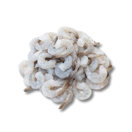 Frozen Shrimp (Penaeus spp.) – Wild caught, head-on shell-on, block frozen, bulk packed from Ireland & UK Pile of raw shrimp on a white background