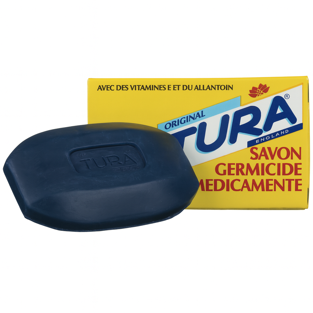 Blue bar of Tura soap in front of its yellow packaging on a white background